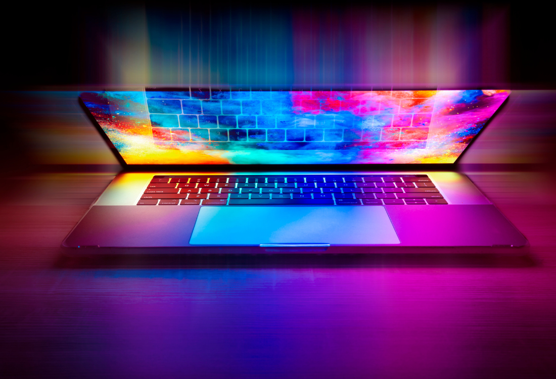 Modern laptop with vibrant rainbow-coloured display illumination, representing the transition from Windows 10 to Windows 11 and the need for businesses to upgrade their hardware and operating systems before the October 2025 end-of-support deadline.